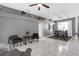 Spacious living area with elevated wall accents, adjacent to a dining area set for comfortable living at 7246 Julian St, New Port Richey, FL 34653
