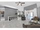 Bright, open living space with white tile flooring, comfortable seating, and a sliding glass door at 7246 Julian St, New Port Richey, FL 34653
