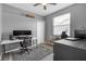 Functional home office with ample desk space, natural light, and neutral decor, perfect for work or study at 7246 Julian St, New Port Richey, FL 34653