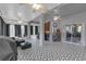 Spacious covered patio features an eye-catching geometric-patterned floor, ideal for outdoor gatherings and entertainment at 7246 Julian St, New Port Richey, FL 34653