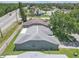 Aerial view of backyard featuring privacy fence and well-kept lawn at 7246 Julian St, New Port Richey, FL 34653