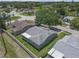 Aerial view showing the home's screened lanai and fenced backyard at 7246 Julian St, New Port Richey, FL 34653