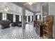 Spacious sunroom with unique flooring, comfortable seating, and abundant light, perfect for relaxing at 7246 Julian St, New Port Richey, FL 34653