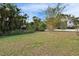 The expansive backyard has mature landscaping, offering a tranquil retreat at 728 Camrose Dr, Brandon, FL 33510
