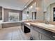 Bathroom with dual vanities, large tub, tile floors and neutral color palette at 728 Camrose Dr, Brandon, FL 33510