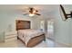 This bedroom features access to the outdoors and a decorative wooden headboard at 728 Camrose Dr, Brandon, FL 33510