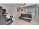 Bedroom with tile flooring, ceiling fan and view of the outdoors from the window at 728 Camrose Dr, Brandon, FL 33510