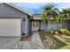 Inviting front entrance featuring double doors, side lights, and well-kept landscaping, leading to a charming home at 728 Camrose Dr, Brandon, FL 33510