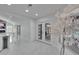 Elegant hallway with marble floors and bright natural light, leading to the pool area at 728 Camrose Dr, Brandon, FL 33510