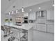 Modern kitchen with stainless steel appliances, an island, and stylish pendant lights at 728 Camrose Dr, Brandon, FL 33510