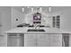 Spacious kitchen with a waterfall island, stainless appliances, and a beverage cooler at 728 Camrose Dr, Brandon, FL 33510