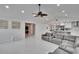 Bright living area with marble floors, gray sectional sofa, view to bedroom and kitchen at 728 Camrose Dr, Brandon, FL 33510