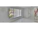 Bright living room with modern white tile flooring, and large window at 728 Camrose Dr, Brandon, FL 33510