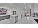 Open-concept living area featuring a modern kitchen, fireplace, and comfortable seating area at 728 Camrose Dr. Dr, Brandon, FL 33510