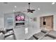 Spacious living room with marble floors, modern fireplace and tv, gray sectional sofa at 728 Camrose Dr, Brandon, FL 33510