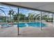 Covered pool area with a screen, lounge chair, and a view of the surrounding landscape at 728 Camrose Dr. Dr, Brandon, FL 33510