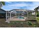 Screened-in pool surrounded by greenery, providing a private and relaxing outdoor space at 728 Camrose Dr, Brandon, FL 33510