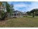 An inviting screened pool area with lush landscaping creates a private backyard oasis at 728 Camrose Dr. Dr, Brandon, FL 33510
