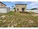 Spacious backyard featuring a storage shed and white vinyl fence at 8452 Silverbell Loop, Brooksville, FL 34613