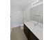 Bathroom featuring a shower-tub combo, vanity, and a ceramic tile floor at 8452 Silverbell Loop, Brooksville, FL 34613