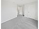 Comfortable bedroom featuring neutral carpet and white door at 8452 Silverbell Loop, Brooksville, FL 34613