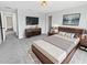 Comfortable bedroom with carpet, modern furniture, and ample natural light for a relaxing atmosphere at 8452 Silverbell Loop, Brooksville, FL 34613