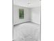Inviting bedroom with neutral carpet and a large window for natural light at 8452 Silverbell Loop, Brooksville, FL 34613