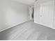 Bright, carpeted bedroom featuring a large closet and neutral paint at 8452 Silverbell Loop, Brooksville, FL 34613