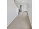 Bright entryway with tile flooring and a view of a half bathroom at 8452 Silverbell Loop, Brooksville, FL 34613