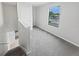 Hallway upstairs with carpet and a view of a window at 8452 Silverbell Loop, Brooksville, FL 34613