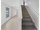 View of the staircase leading to the upper level of the home at 8452 Silverbell Loop, Brooksville, FL 34613