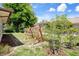 Backyard featuring a swing and lush landscaping at 10820 Hachita Dr, Port Richey, FL 34668