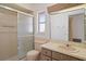 Bathroom featuring a shower, vanity with a sink, and a toilet, all in a vintage color scheme at 10820 Hachita Dr, Port Richey, FL 34668