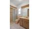 Neutral-toned bathroom with a shower, vanity, and toilet featuring a unique vintage style at 10820 Hachita Dr, Port Richey, FL 34668