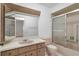 Bathroom featuring a vanity with mirror and sink, and a shower/tub combination in a neutral color scheme at 10820 Hachita Dr, Port Richey, FL 34668