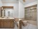 Retro bathroom featuring a vanity with wood cabinets, peach fixtures, and a shower with sliding glass doors at 10820 Hachita Dr, Port Richey, FL 34668