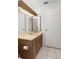 Bathroom featuring a vanity with mirror and sink, with a toilet and shower in view at 10820 Hachita Dr, Port Richey, FL 34668