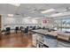 Well-lit craft room equipped with tables, storage, and crafting supplies for residents to enjoy creative activities at 10820 Hachita Dr, Port Richey, FL 34668