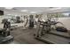 Well-equipped gym featuring treadmills, weight machines, and mirrored walls at 10820 Hachita Dr, Port Richey, FL 34668