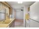 Kitchen features yellow countertops, wood cabinets, and ample counter space at 10820 Hachita Dr, Port Richey, FL 34668