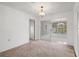 An airy living space with a sliding glass door to adjacent living area at 10820 Hachita Dr, Port Richey, FL 34668