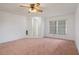 Bright living room with neutral paint, and large window allowing natural light to fill the space at 10820 Hachita Dr, Port Richey, FL 34668