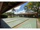 Outdoor shuffleboard courts under a covered pavilion at 10820 Hachita Dr, Port Richey, FL 34668