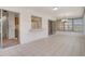 Bright sunroom featuring tile floors, sliding doors, and large windows offering plenty of natural light at 10820 Hachita Dr, Port Richey, FL 34668