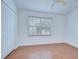 Light bedroom features a window and a closet at 11304 Cayman Key Ave # 2, Tampa, FL 33624