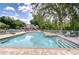 Inviting community pool with brick patio and lounge chairs at 11304 Cayman Key Ave # 2, Tampa, FL 33624