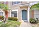 Well-maintained townhome front door and manicured lawn at 11304 Cayman Key Ave # 2, Tampa, FL 33624