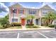 Charming townhome with colorful shutters and tropical landscaping at 11304 Cayman Key Ave # 2, Tampa, FL 33624