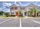 Inviting townhome with colorful shutters and lush landscaping at 11304 Cayman Key Ave # 2, Tampa, FL 33624