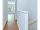 Second floor hallway view of bright bedroom with light streaming in at 11304 Cayman Key Ave # 2, Tampa, FL 33624